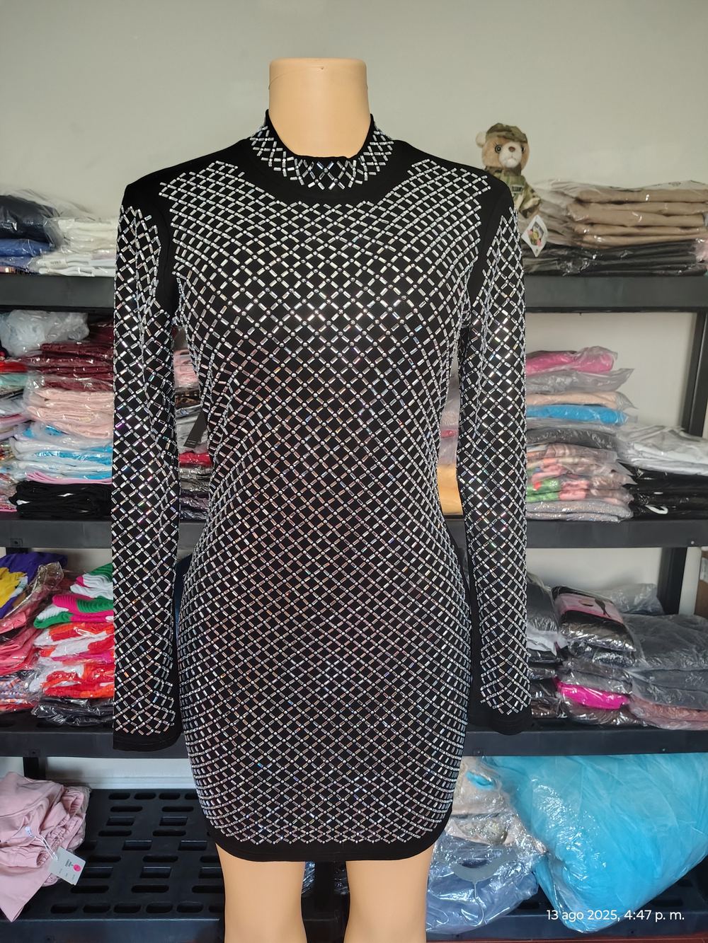 Black rhinestone formal dress on display at Liz Fashion