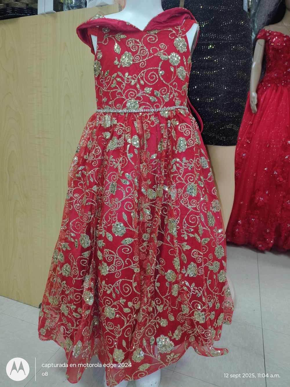 Red sequin quinceañera gown on display at Liz Fashion